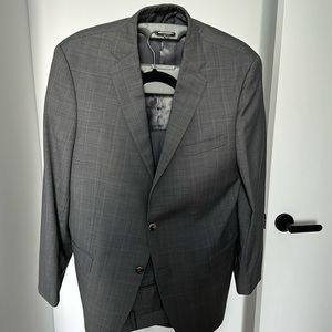 Barley worn Hart Schaffer Marx two button grey and light blue plaid suit